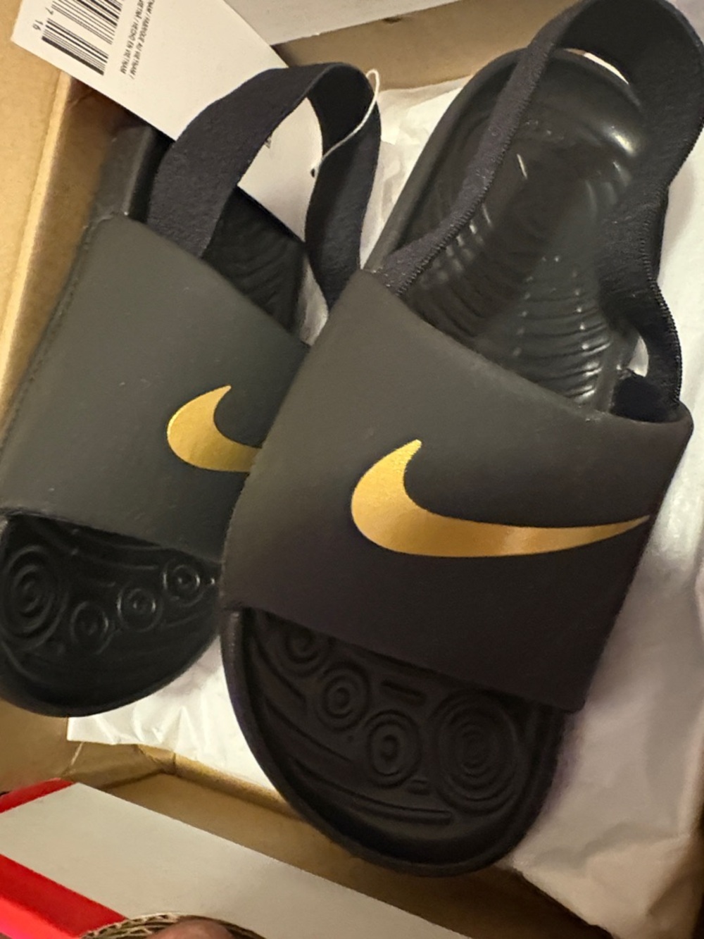 Nike Kids Black Slides with Gold Swoosh